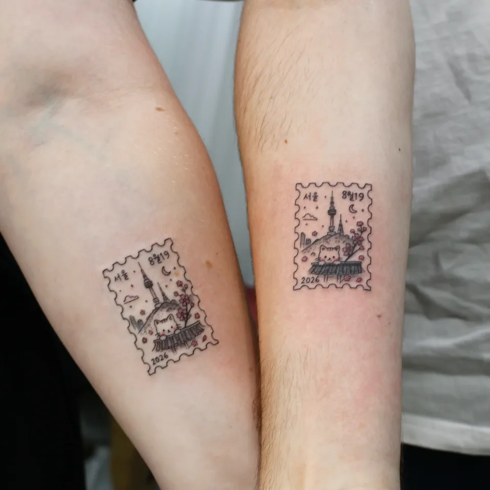 Tattoo artwork shared by Yeonjae Tattoo — A matching stamp tattoo for a traveling couple…