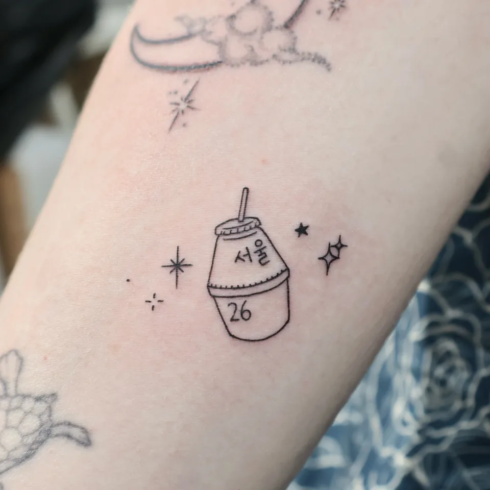 Tattoo artwork shared by Yeonjae Tattoo — A tiny Seoul souvenir tattoo. 🥤✨