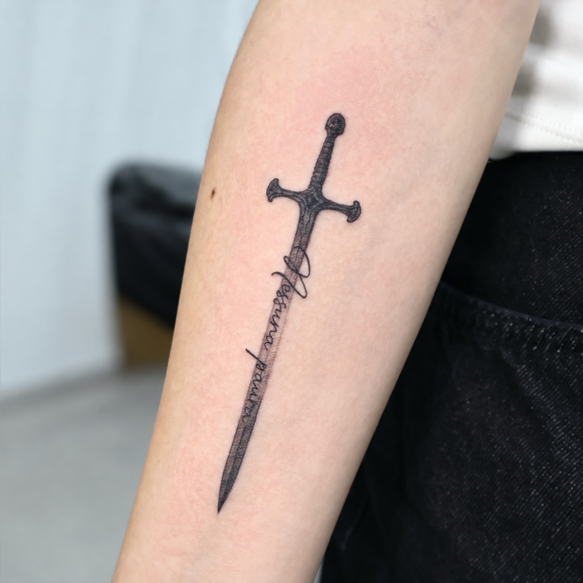 A sword tattoo with a personal quote — Yeonjae Tattoo